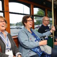 Alumni laughing on the Trolley.